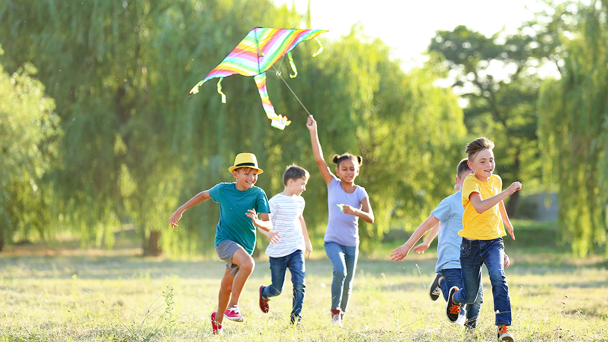 Group of children flying a kite