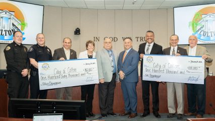 Supervisor Baca, Jr with representatives from the City of Colton at a check presentation ceremony