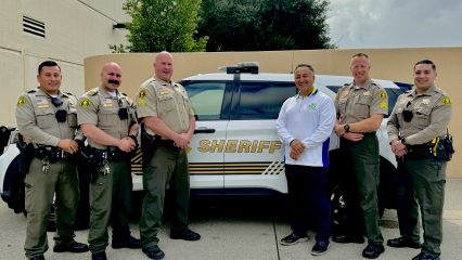 Supervisor Joe Baca, Jr. with San Bernardino County Sheriff Deputies