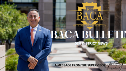 Banner of Supervisor Joe Baca, Jr. in front iof the Government Building