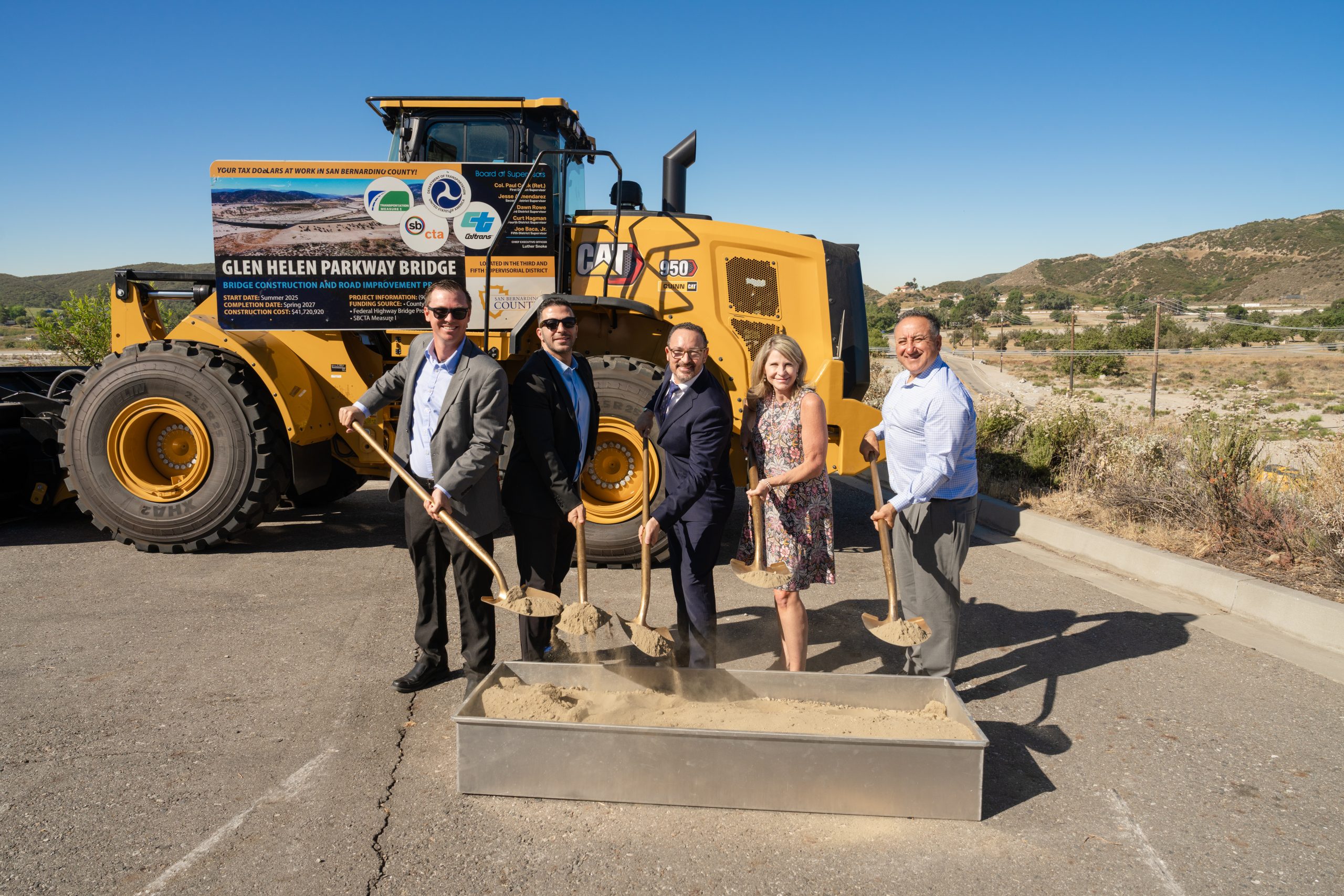 Board of Supervisors Chair Dawn Rowe and Vice Chair Joe Baca, Jr., with Deputy Executive Director Officer Moe Yousiff and Public Works Director Noel Castillo breaking ground at Glen Helen Parkway Bridge.