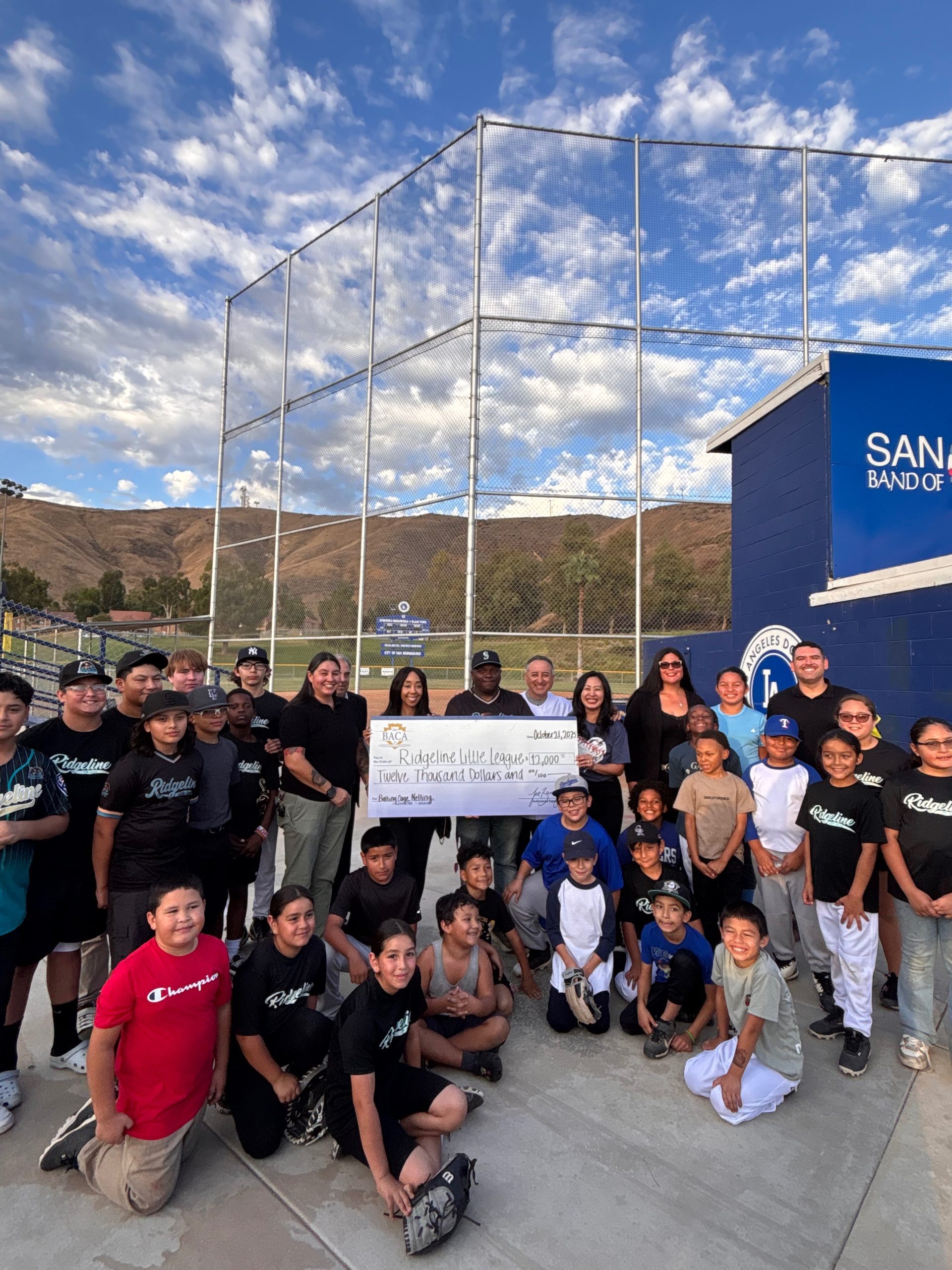 Supervisor Joe Baca, Jr. with Mayor Helen Tran, Councilmember Kim Knaus, Councilmember, Mario Flores, Councilmember Dr. Treasure Ortiz, along with Ridgeline Little League President Preston White, and players.