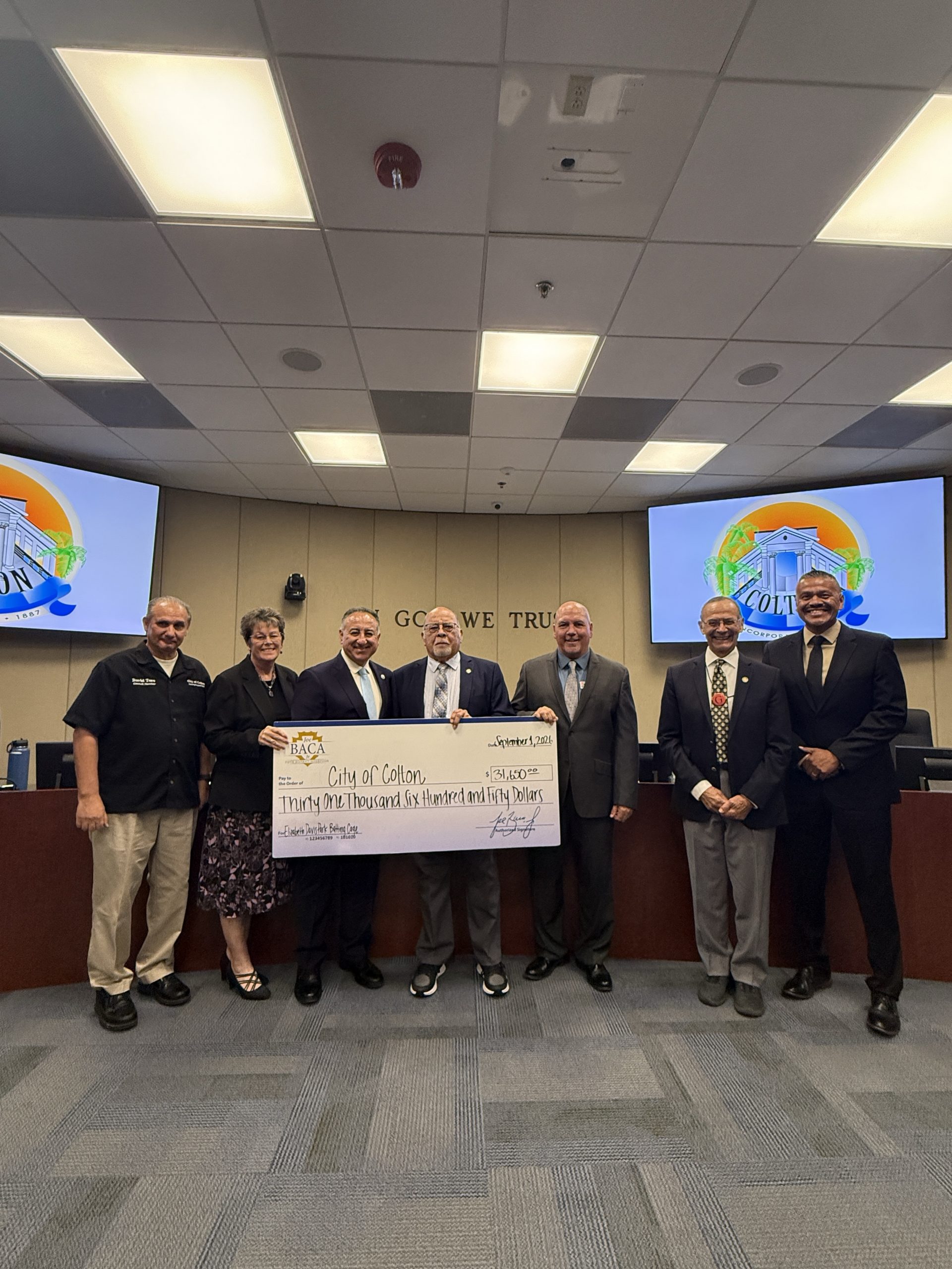 Supervisor Baca, Jr. presenting $31,000 check to Colton City Council for the Elizabeth Davis Park batting cages and baseball fields.